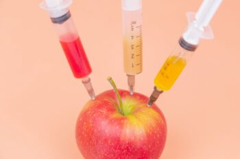 food science represented by apple and three syringes