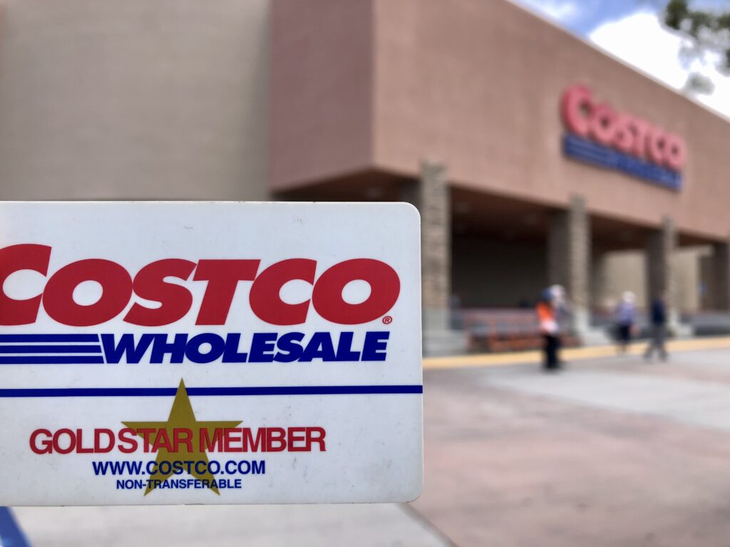 COSTCO Wholesale store entrance sign and membership card