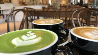 matcha latte, two cafe latttes in a cafe