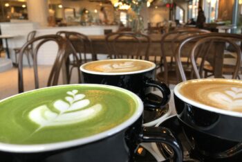 matcha latte, two cafe latttes in a cafe